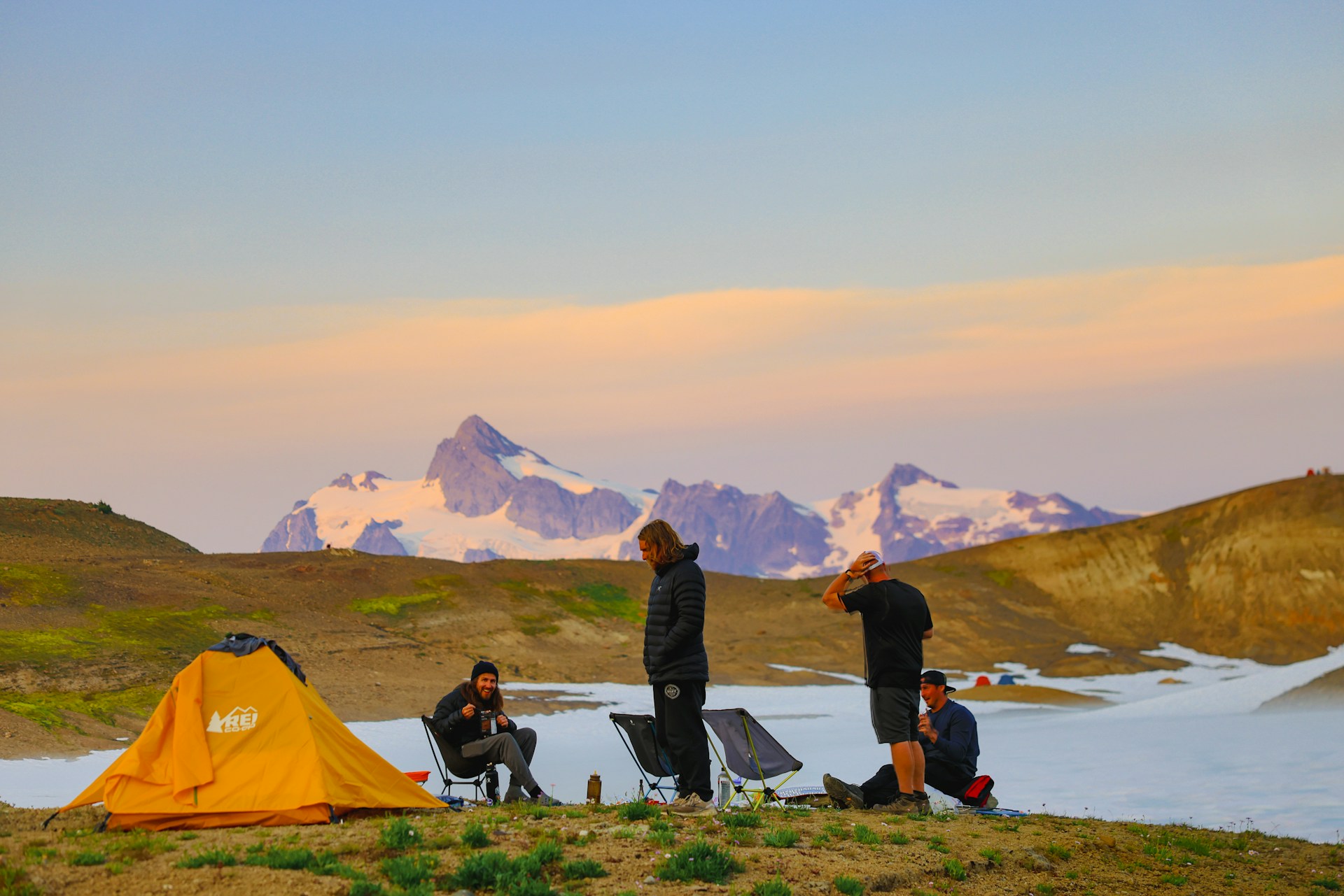 Campers beside a mountain lake