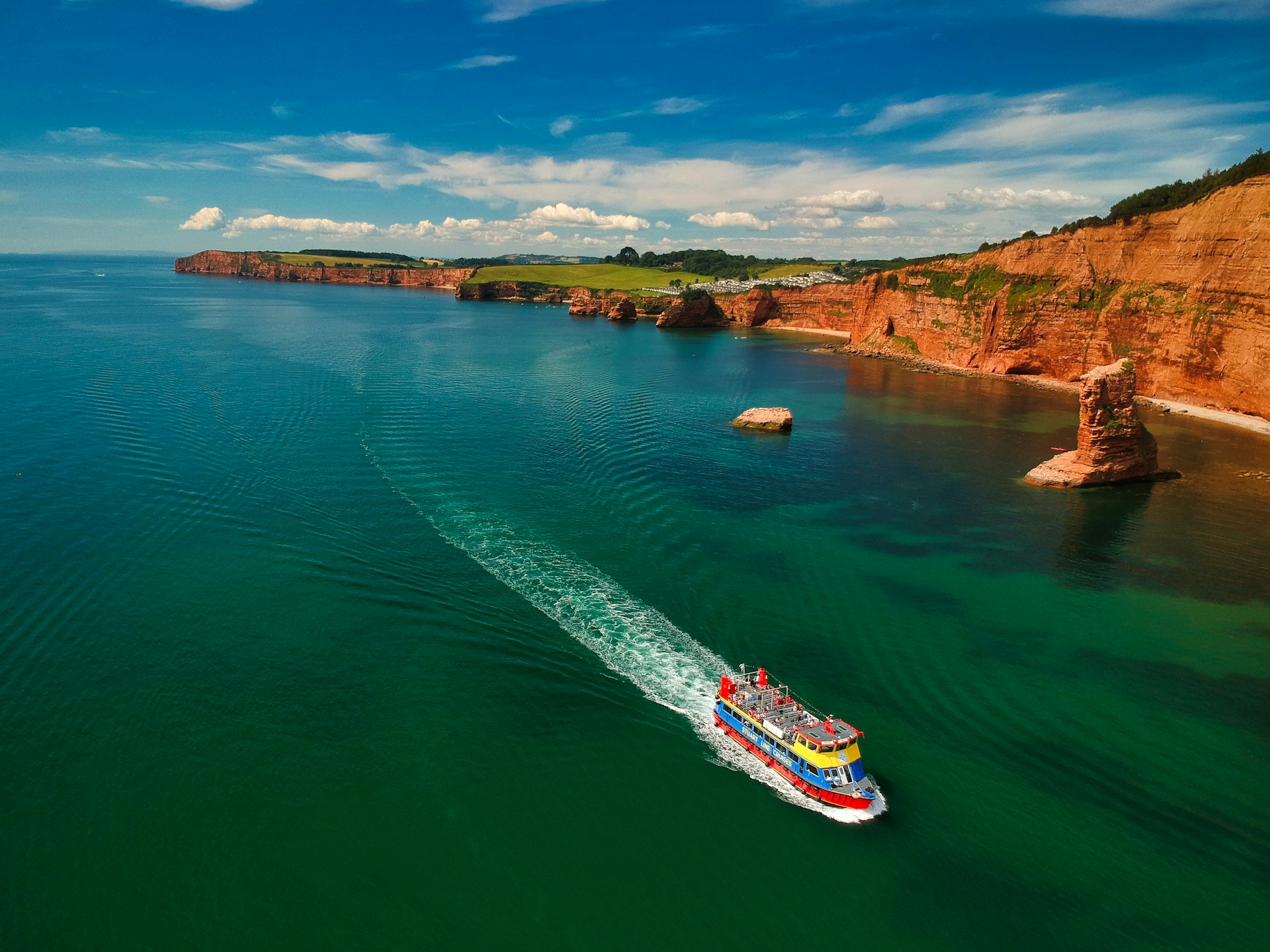 Sea cliffs and a ferry